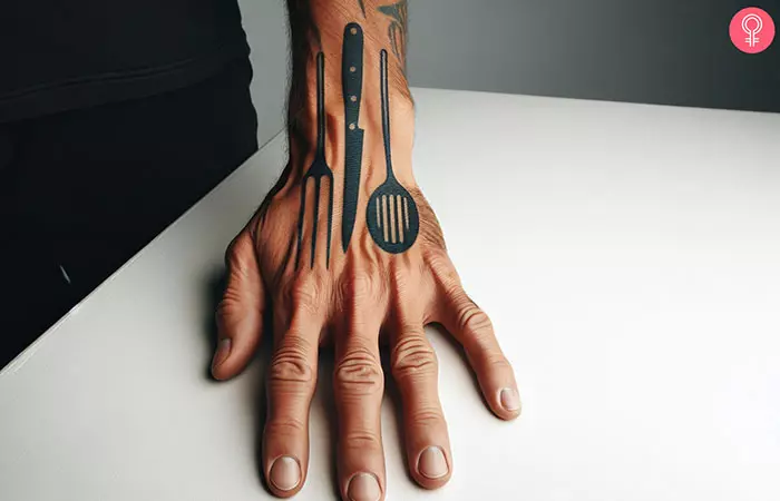 A chef tattoo on the back of the hand