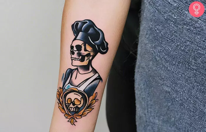 A traditional tattoo of a skull in a chef’s uniform