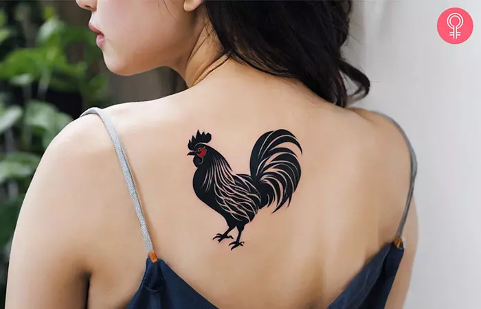 Chinese rooster tattoo on the upper back