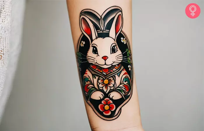 A woman with a Chinese zodiac rabbit tattoo on the lower arm