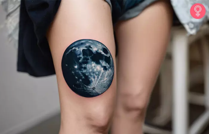 A cool above knee tattoo of a realistic moon