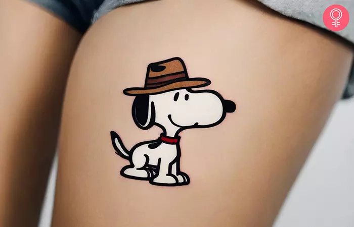 Cowboy Snoopy tattoo on the thigh