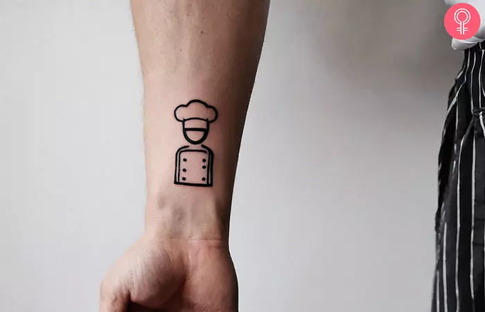 A traditional tattoo of a male chef on the forearm