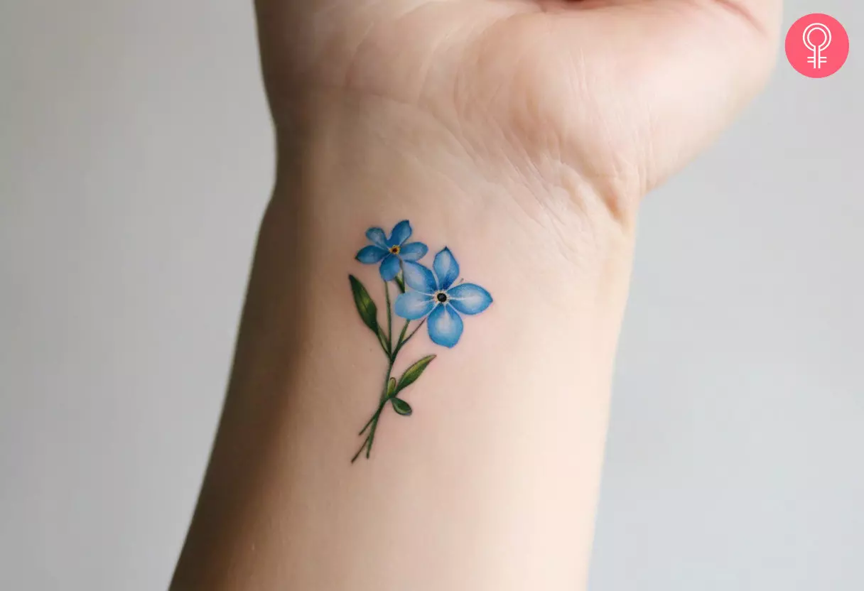 Dainty forget me not flower tattoo on the wrist
