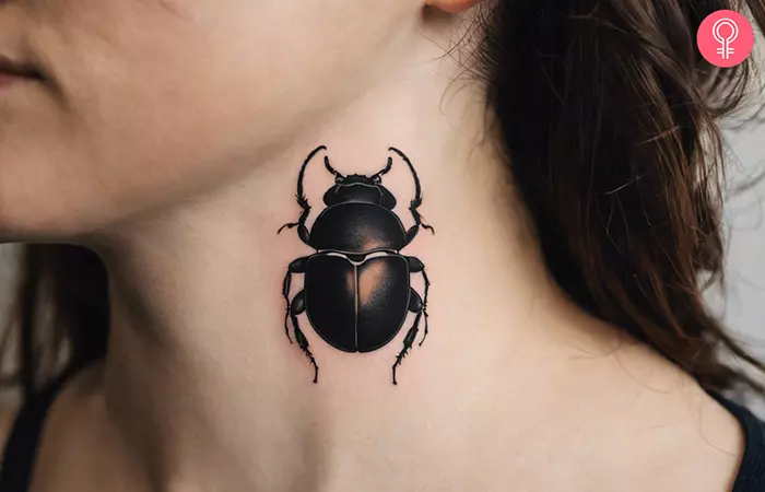 Dung beetle tattoo on the neck