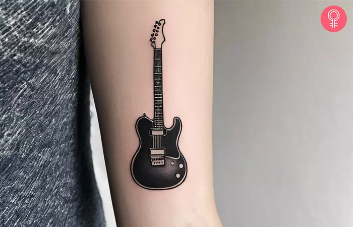 Electric guitar tattoo on the upper arm