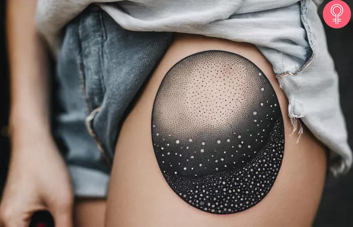 dotwork tattoo of a starry night on a woman’s thigh