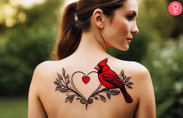 woman with Feminine Cardinal Tattoo on her upper back