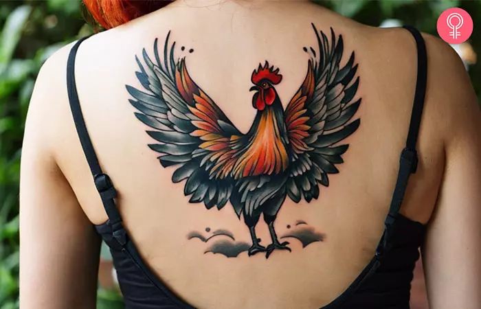 Fighting rooster tattoo on the upper back