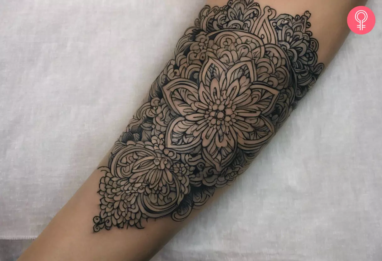 A woman with a filigree forearm tattoo