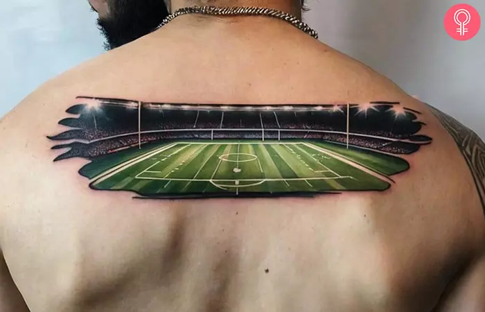 A man with a football field tattoo on his back