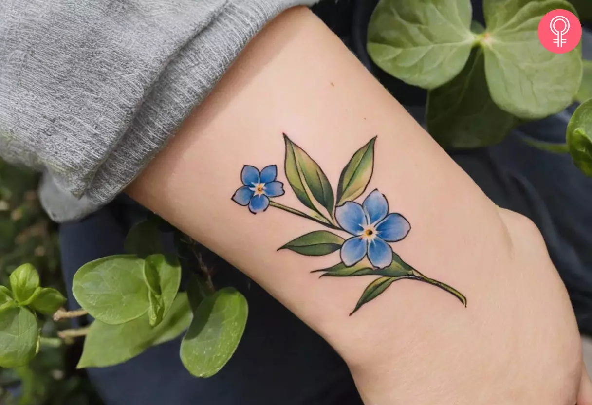 Forget me not flower tattoo on her wrist