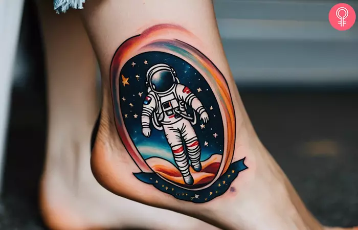 Galaxy astronaut tattoo on the ankle