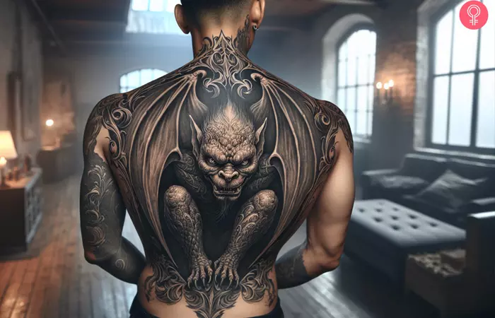 A gargoyle tattoo on the back of a man