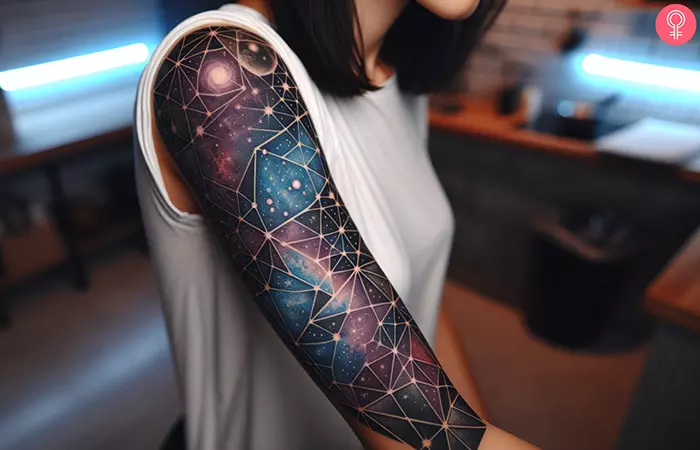 Geometric galaxy tattoo on the upper arm