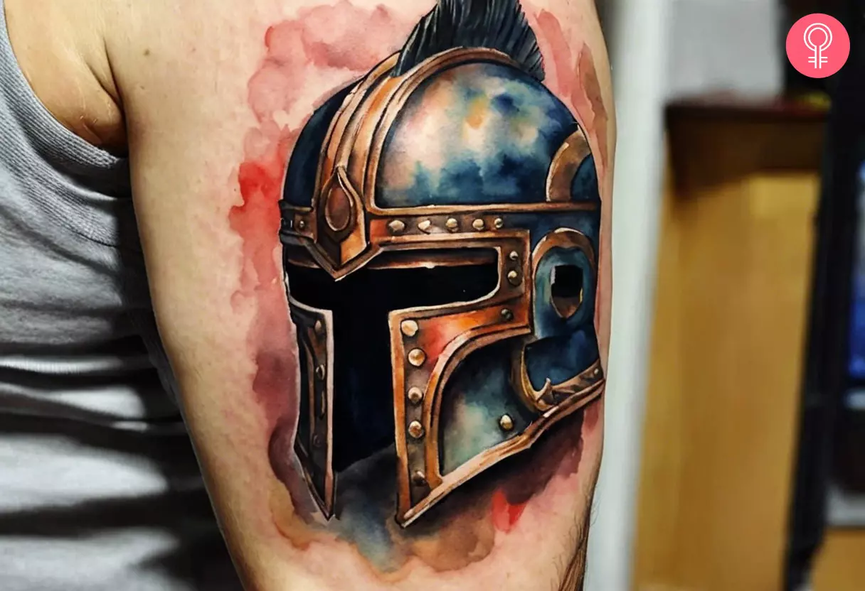 Gladiator helmet tattoo on the upper arm