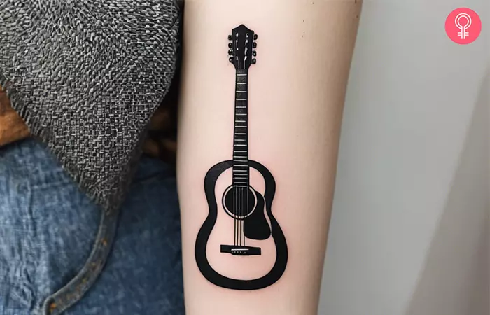  Guitar tattoo on the forearm