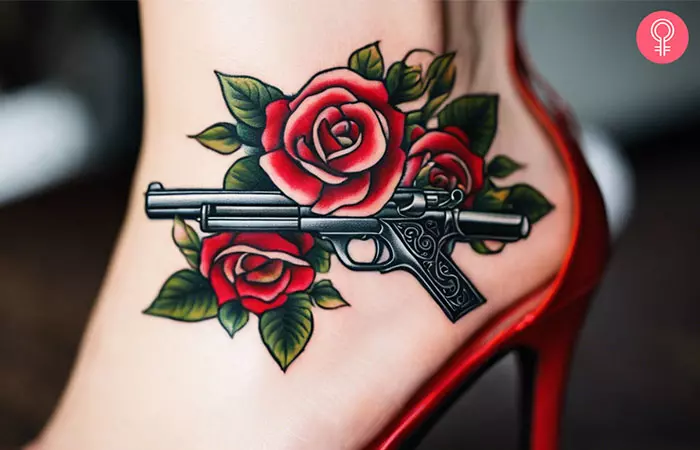 Gun and rose tattoo on the ankle