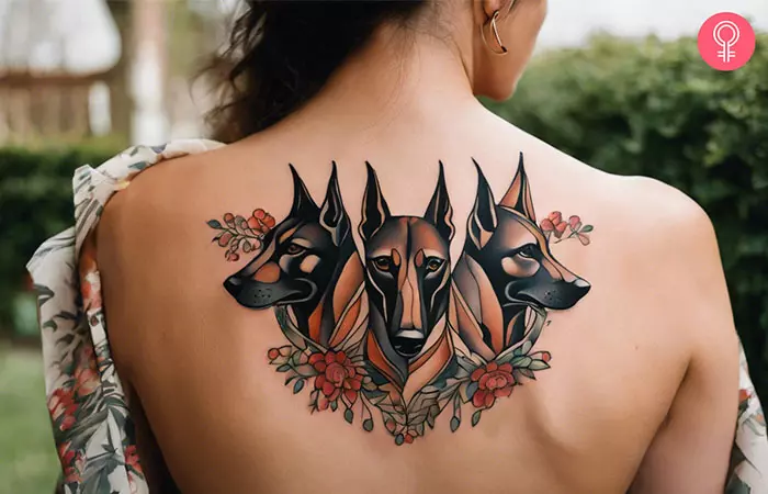 A tattoo of a 3-deaded Doberman on the back