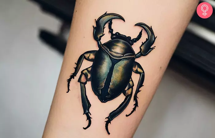 Hercules beetle tattoo on the forearm