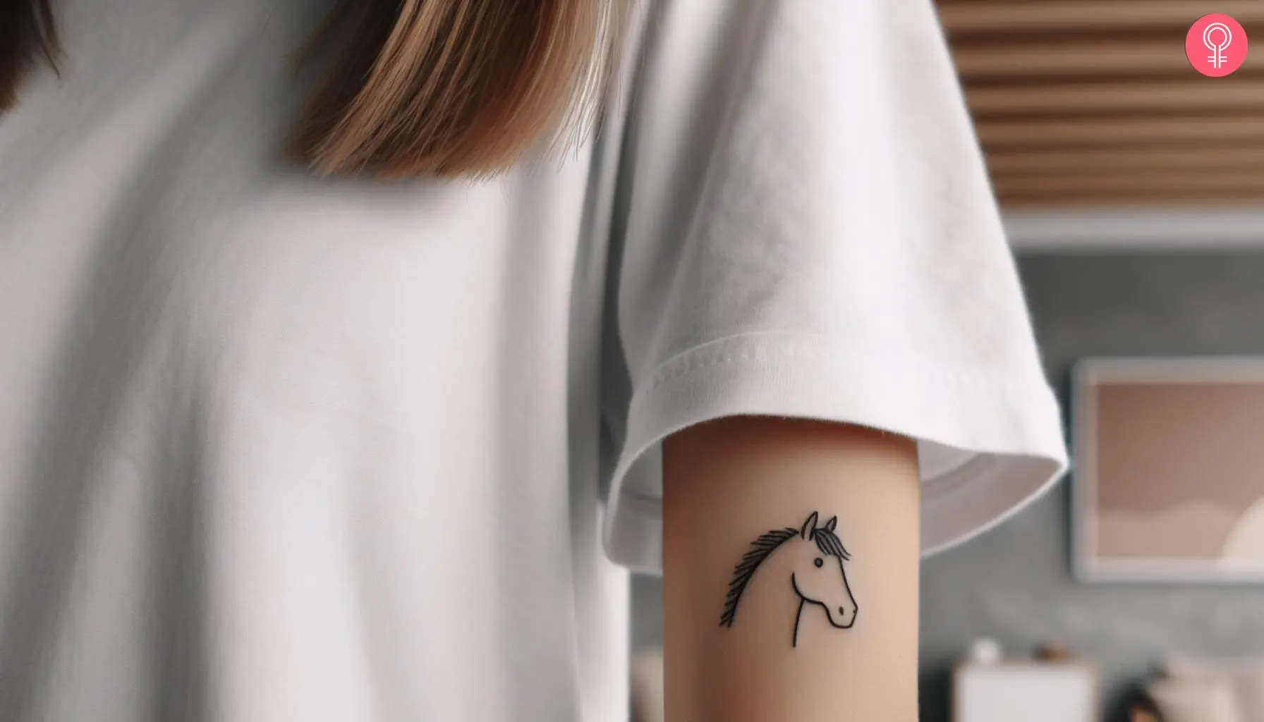 A horse face outline tattoo on a woman’s upper arm