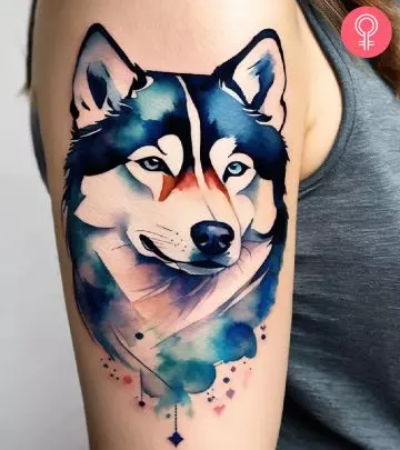 A woman with a vibrant dog tattoo on her forearm