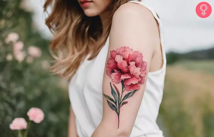 Carnation birth flower tattoo on the arm