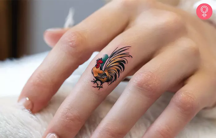 Japanese rooster tattoo on the finger