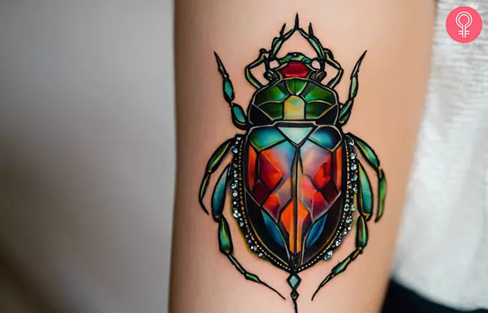 Jewel beetle tattoo on the forearm