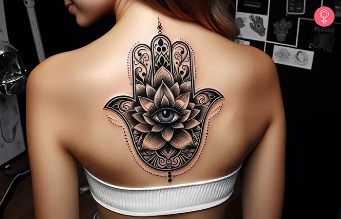 Lotus hamsa tattoo on the back