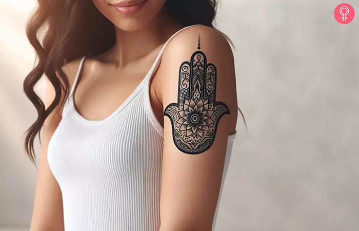 Mandala lotus hamsa tattoo on the upper arm