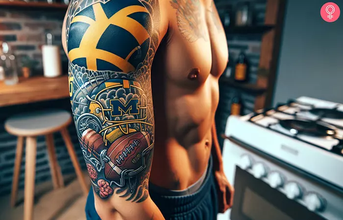 A man with a Michigan football sleeve tattoo