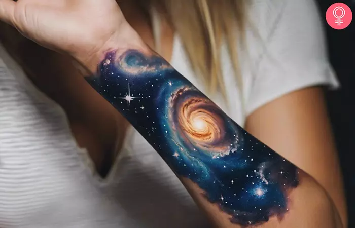 Milky way galaxy tattoo on the forearm