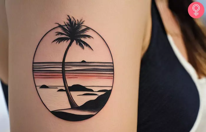 Woman with a minimalist beach tattoo
