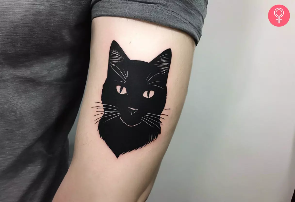 Minimalist black cat tattoo