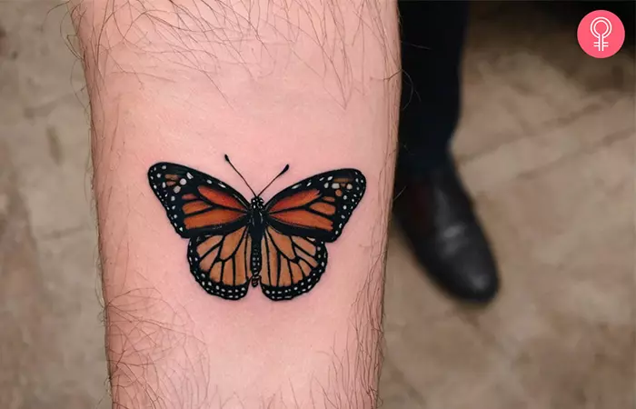 A monarch butterfly tattoo for men on the forearm