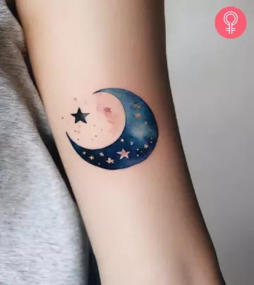 An Aries tattoo on the upper arm of a woman