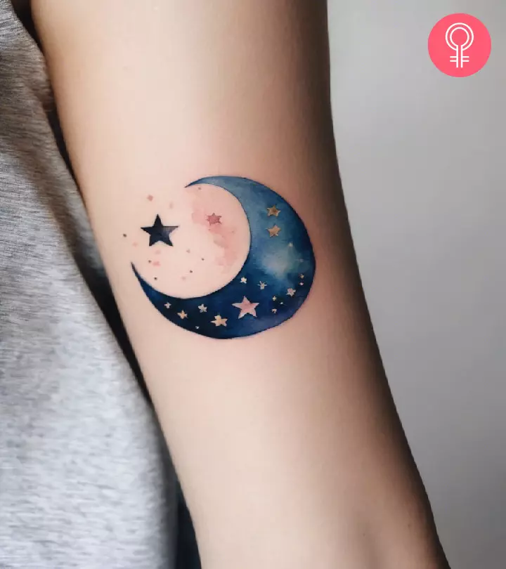 A moon and stars tattoo on the arm