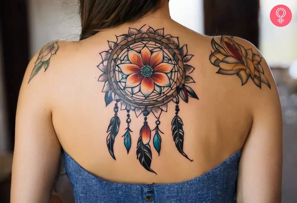 Native American flower tattoo on a woman’s back