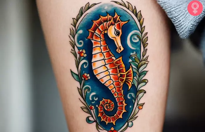 A woman showing a nautical seahorse tattoo on her arm