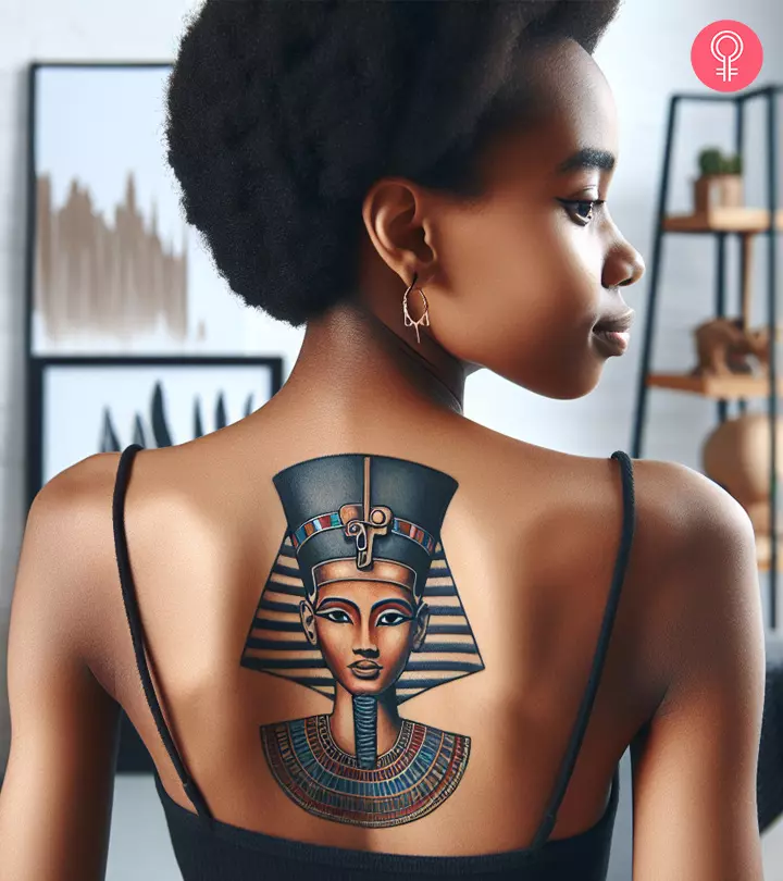 Nefertiti tattoo on a woman’s back
