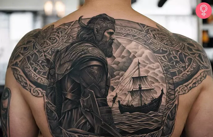 A man with an Odin and Viking ship tattoo on his back