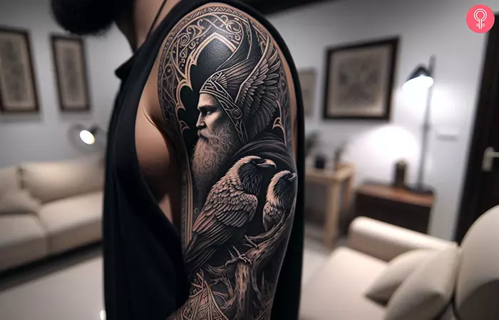 A man with Odin’s ravens tattoo on his arm