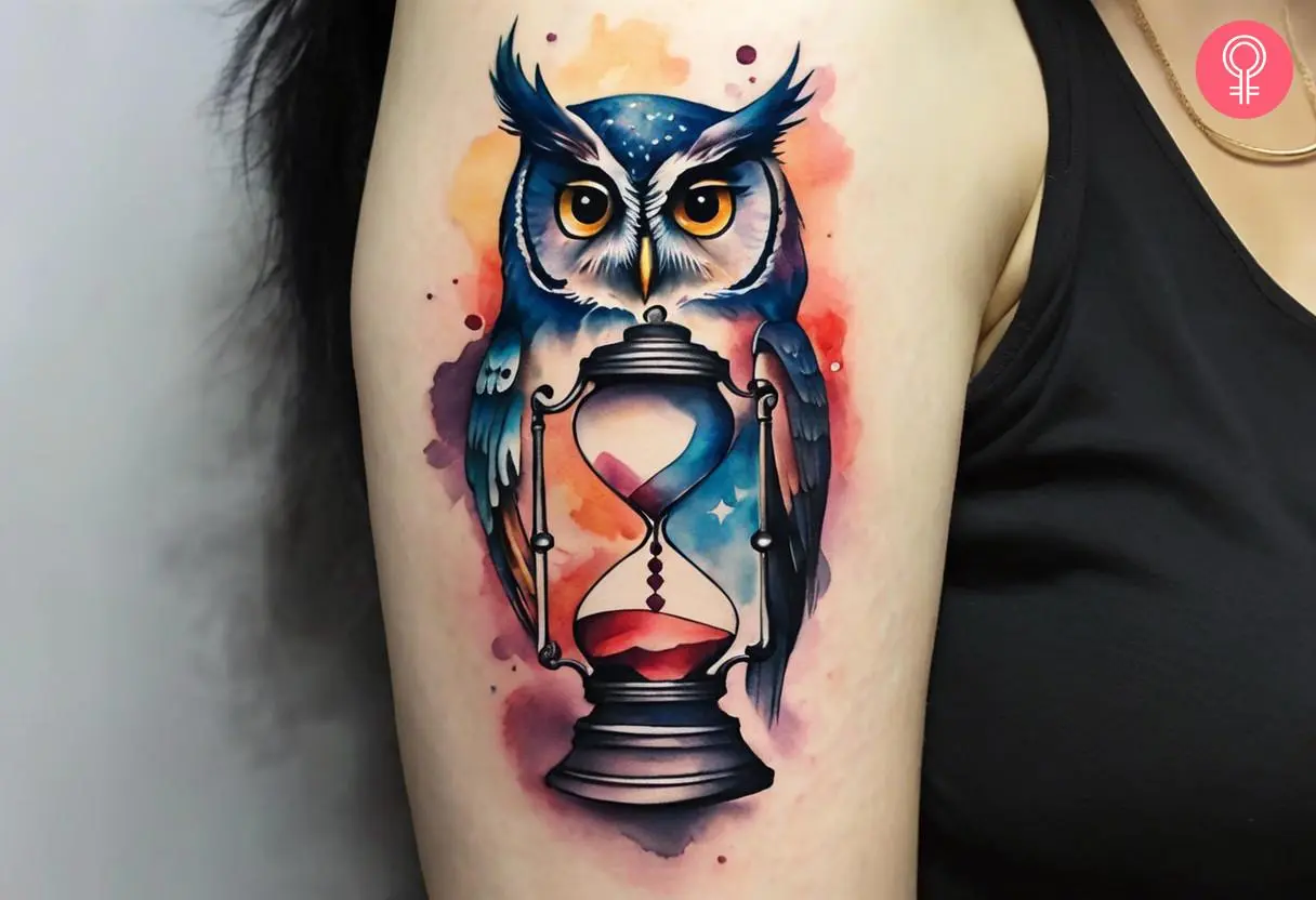 Owl and hourglass tattoo on the arm