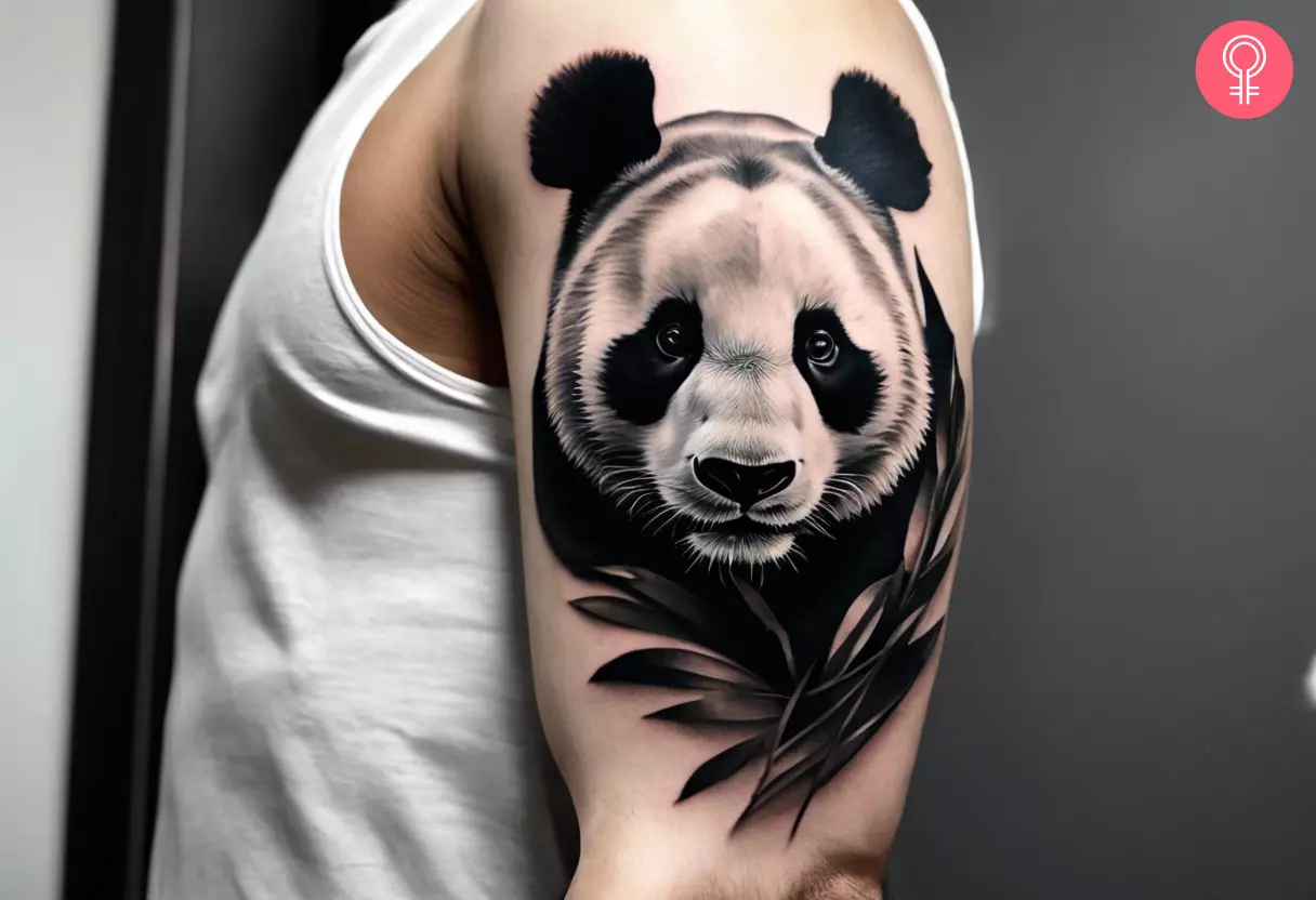 A man with a panda tattoo design on the upper arm