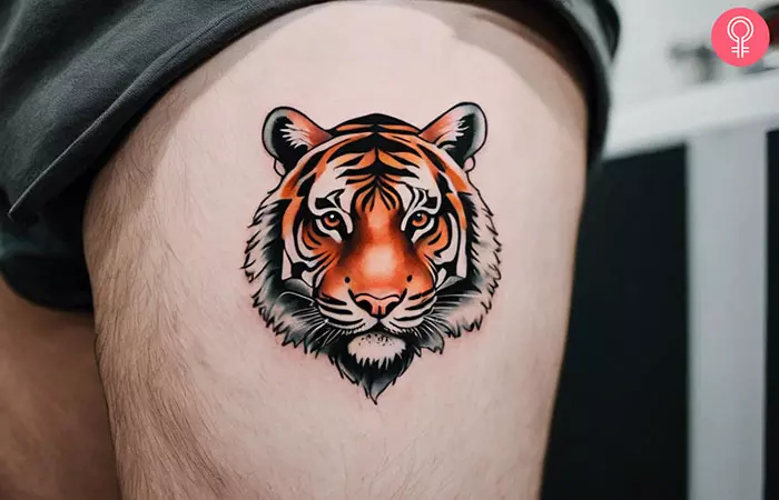 A pretty tiger tattoo on the side thigh