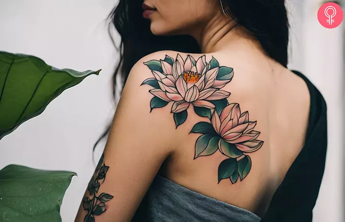 Pretty lotus blooms on a vine at the back of the shoulder