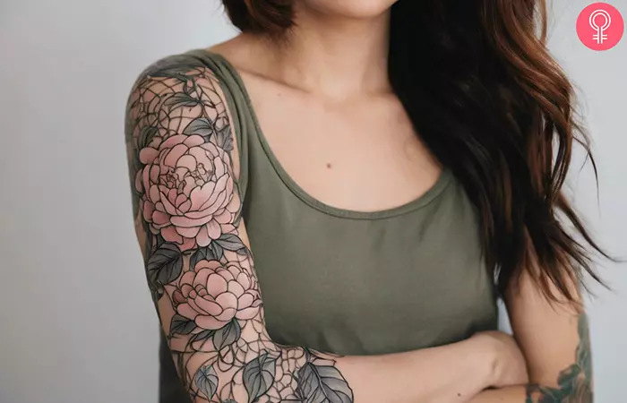 Pretty peony flower vine sleeve tattoo