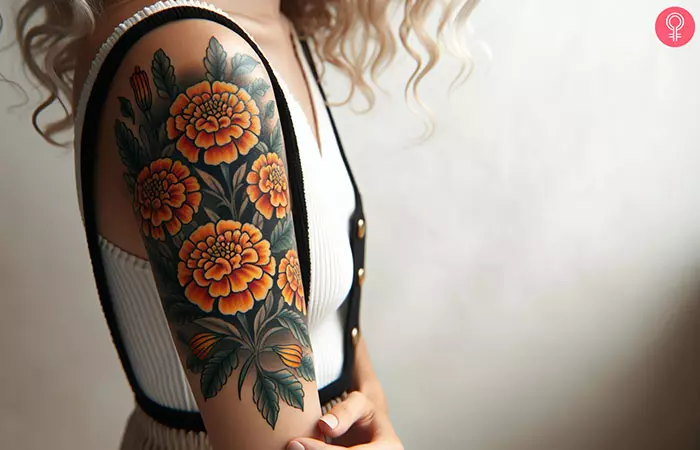 realistic marigold tattoo on the upper arm