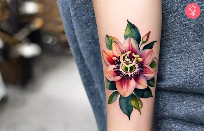 Religious passion flower tattoo on the forearm